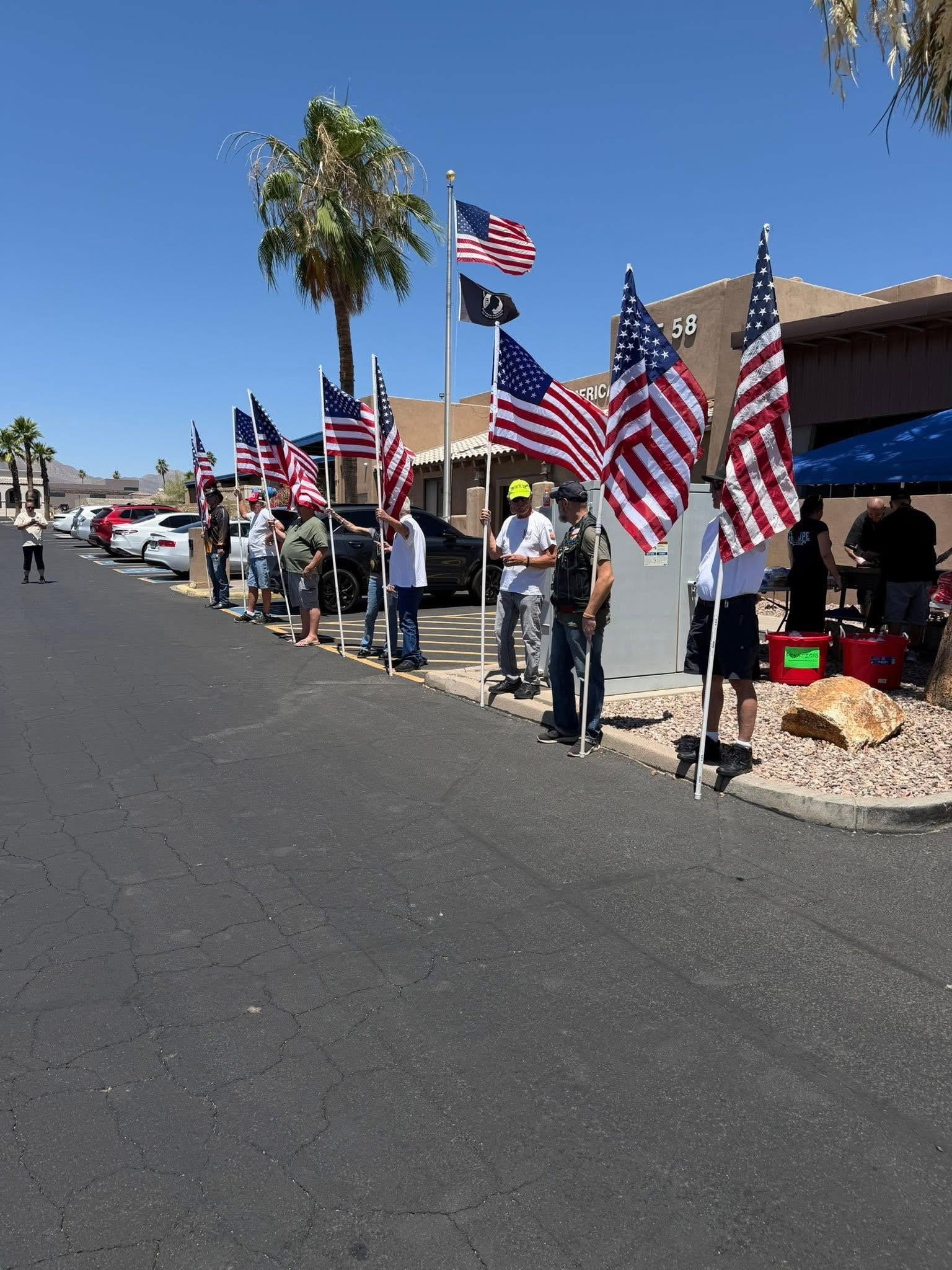 ALR members holding American flags outside Post 58