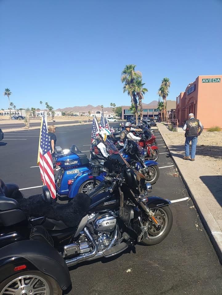 ALR motorcycles lined up with American flags