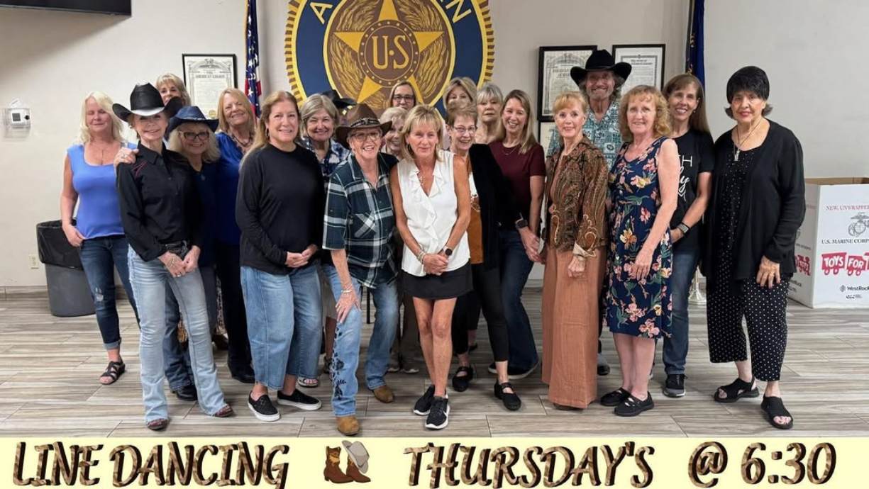 Auxiliary members line dancing at Post 58 event