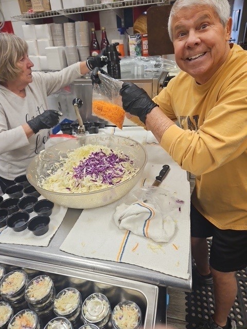 SAL volunteers making coleslaw