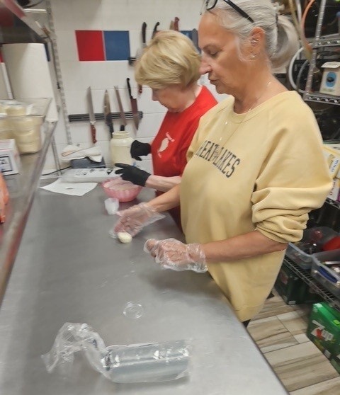 SAL volunteers preparing food